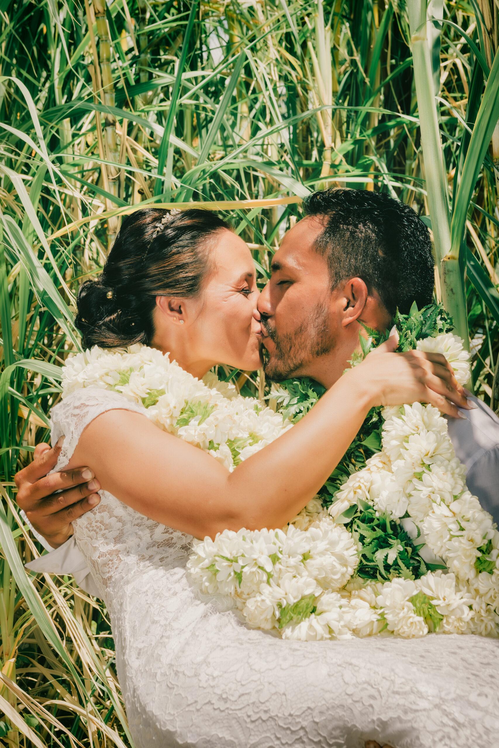 Couple kissing in Tahiti French Polynesia, photographed in a film-inspired style.